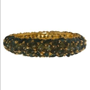 Kenneth Jay Lane this bangle consists of oval-shaped dark bluish crystals